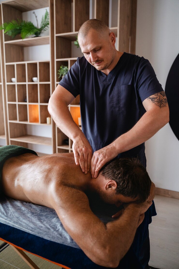 high-angle-man-getting-massage_23-2150649770