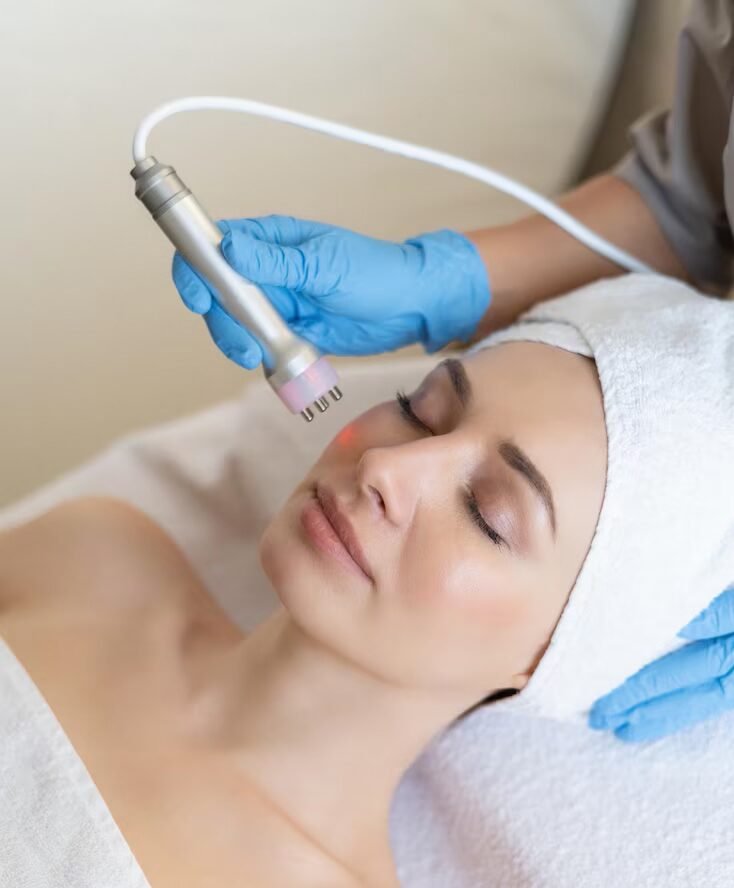 young-woman-lying-cosmetologist-s-table-rejuvenation-procedure-cosmetologist-take-care-about-neck-face-skin-youthfull-wellness-hardware-face-cleaning-procedure_343596-7874 young-woman-lying-cosmetologist-s-table-rejuvenation-procedure-cosmetologist-take-care-about-neck-face-skin-youthfull-wellness-hardware-face-cleaning-procedure_343596-7874